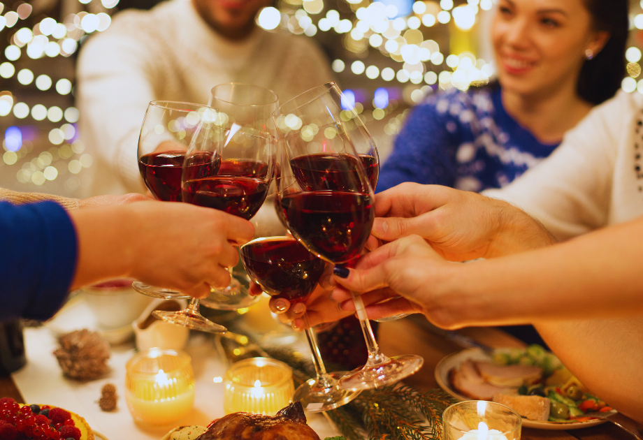 holiday cheers with wine glasses